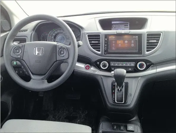  ?? — PHOTOS: JOHN LEBLANC, DRIVING ?? The dash-mounted gear selector frees up space for the centre console to hold mugs and phones.