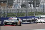  ?? WILFREDO LEE — THE ASSOCIATED PRESS ?? Noah Gragson (9) and Harrison Burton (20) battle during a NASCAR Xfinity Series auto race Sunday, June 14, 2020, in Homestead, Fla.