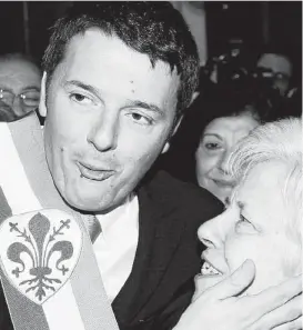  ?? Associated Press ?? Florence Mayor Matteo Renzi celebrates Friday as he greets couples who’ve been married for over 50 years. He’s on his way to being Italy’s next prime minister.