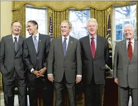  ?? J. Scott Applewhite Associated Press ?? ‘EX-PRESIDENTS CLUB’ in 2009: President-elect Barack Obama is welcomed to the job by George H.W. Bush, George W. Bush, Bill Clinton and Jimmy Carter.