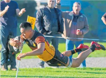  ?? Photo / Stuart Whitaker ?? Sonny Collier goes over for the try that, once converted, put Te Puke Sports in the lead. More photos on page 12.