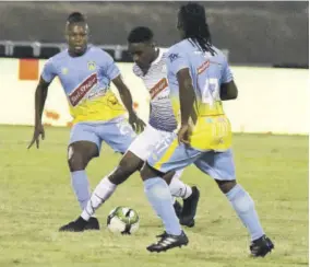  ?? (Photo: Observer file) ?? Action between Portmore United (white shirt) and Waterhouse FC during the eventually cancelled 2019/2020 season of the then Red Stripe Premier League.