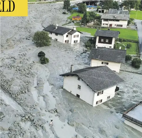  ?? AFP/GETTY IMAGES ?? The Swiss village of Bondo near the Italian border was evacuated after a mudslide hit Wednesday.