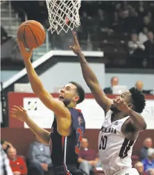  ?? Ben Margot / Associated Press ?? St. Mary’s Jordan Ford (left) lays up a shot ahead of Santa Clara’s KJ Feagin. The Gaels shot 55.2 percent from the floor.