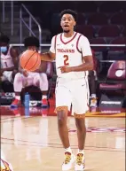  ?? Brian Rothmuller / Icon Sportswire via Getty Images ?? USC’s Tahj Eaddy, a state native, dribbles during a game against California Baptist in Los Angeles last week.