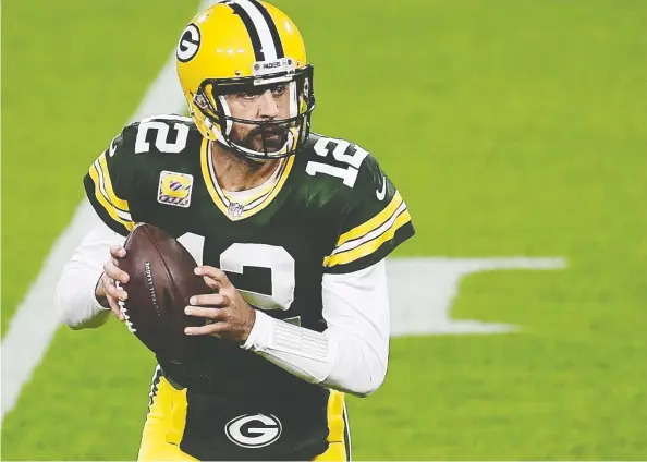  ?? STACY REVERE / GETTY IMAGES ?? With limited or no fans allowed in stadiums, NFL quarterbac­ks such as Green Bay's Aaron Rodgers have weaponized their voices like never before.