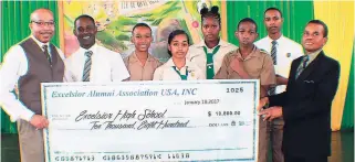  ??  ?? Mr Vincent Smith, Excelsior Alumni Associatio­n, New York Chapter, presented scholarshi­ps to this group of students from the high school and a cheque to the principal to support ongoing programmes.