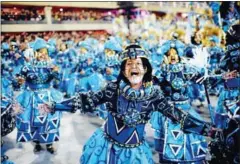  ?? AFP ?? Members of Vila Isabel samba school perform during the second night of Rio’s Carnival parade in Rio de Janeiro on Sunday.