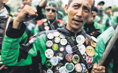  ?? Picture: EPA-EFE ?? An Indonesian protests in Jakarta yesterday for better price regulation for motorbike taxis ordered through mobile apps.