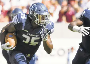  ?? GETTY IMAGES FILE ?? Jeremy Cox carries the ball during a loss at Virginia Tech in 2017. ODU gets a rematch Saturday in Norfolk.