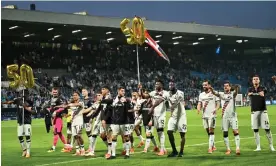  ?? Photograph: Ina Fassbender/AFP/Getty Images ?? Bayer Leverkusen players celebrate in front of their fans after stretching their unbeaten run to 50 games.