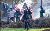  ?? THE OLYMPIAN VIA AP ?? Supporters of President Donald Trump and antifa supporters clashed with Washington state police on the state Capitol Campus in Olympia, Wash., Saturday. One person was shot.