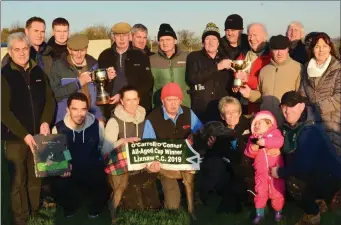  ?? Photo by David O’Sullivan ?? The sponsors and Paddy Quilter presenting the cup to Tom O’Connor and Richie Mee after their dog, Cruyff, won the O’Carroll/O’Connor Cup at Lixnaw coursing on Sunday.