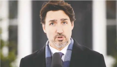  ?? SEAN KILPATRICK / THE CANADIAN PRESS ?? Prime Minister Justin Trudeau addresses Canadians on the COVID-19 situation from his isolation at Rideau Cottage in Ottawa on Tuesday.