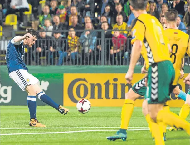  ?? Pictures: SNS. ?? Left: Stuart Armstrong heads Scotland’s opener before former Dundee United team-mate Andy Robertson, above, curls home the second.