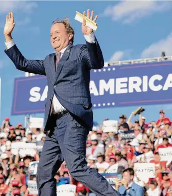  ?? Nick Wagner/Associated Press ?? Texas Attorney General Ken Paxton waves to the crowd during a rally featuring former President Donald Trump in Robstown. Paxton faces an impeachmen­t trial in the state Senate.