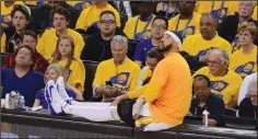  ?? DAN HONDA/TRIBUNE NEWS SERVICE ?? Golden State Warriors' JaVale McGee (1) stretches on the scorer's table during a timeout against the Portland Trail Blazers during the first round of the playoffs on April 16.