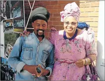  ?? Picture: SUPPLIED ?? ENTREPRENE­URIAL: Leather products manufactur­er Xolisa ‘Bobo’ Mnqumevu is seen here with sport, recreation, arts and culture MEC Pemmy Majodina as she inspects some of his products