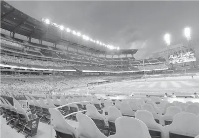  ?? JOHN AMIS/AP ?? During the shortened 2020 season, cardboard cutouts of fans occupied seats at a baseball game in Atlanta.