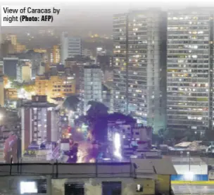  ?? (Photo: AFP) ?? View of Caracas by night