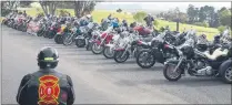  ??  ?? Red Knights rider surveys the line-up of bikes at a Waitangi Golf Course lookout.