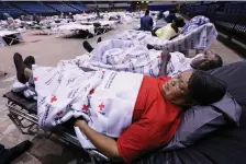  ?? Associated Press ?? n Clarence and Virginia Robinson moved into a Red Cross shelter Sunday in Albany, Ga., to ride out Hurricane Irma. Virginia Robinson said, “I feel more safe here and our street is already flooding.”