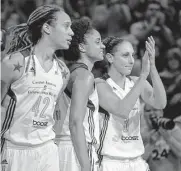  ?? Matt York/associated Press ?? Spurs assistant Candace Dupree, center, was “just glad” to have Brittany Griner, left, home Thursday. The two were WNBA teammates from 2013 to 2016.