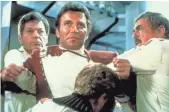  ?? PARAMOUNT PICTURES ?? Dr. McCoy (DeForest Kelley, left) and Scotty (James Doohan) hold Kirk back as Spock dies.