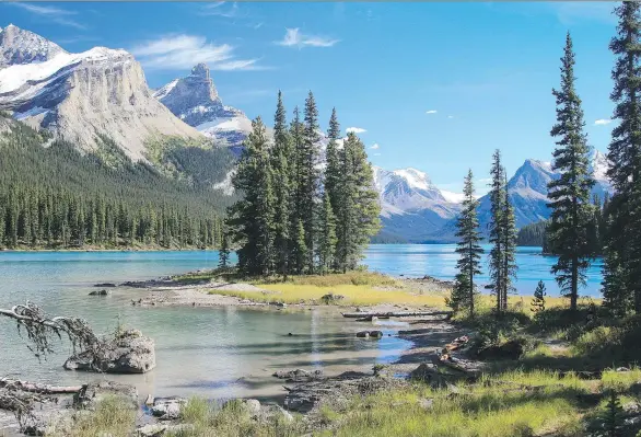  ?? GETTY IMAGES ?? Spirit Island is an iconic sight on Jasper National Park’s Maligne Lake, the largest glacier-fed lake in the Canadian Rockies, and a photograph­er’s dream.