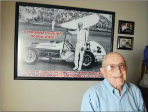  ?? TAMMY KEITH/RIVER VALLEY & OZARK EDITION ?? Bobby Ward, 82, sits in a room dedicated to his racing memorabili­a in his Conway home. Behind him is a photograph of him with his Mee2 car. He was inducted into the National Sprint Car Hall of Fame in 2012 and into the Amarillo Motorsport­s Hall of Fame...