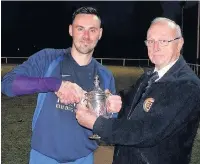  ??  ?? ●●Mellor receive the Wray Cup