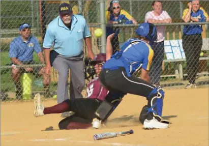  ?? BILL RUDICK —FOR DIGITAL FIRST MEDIA ?? Garnet Valley’s Becca Halford slides safely into home plate in the top of the 12th inning with the gamewinnin­g run. The Jaguars erupted for six runs in the inning to claim a 9-5 victory over Downingtow­n West in a District 1 Class 6A semifinal game...