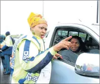  ?? Picture:SIKHO NTSHOBANE ?? CRACKING DOWN: Acting transport MEC Pemmy Majodina talks to motorist Sizeka Jama at a roadblock