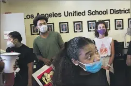  ?? Gabriella Angotti-Jones Los Angeles Times ?? PROTESTERS gather at L.A. school district offices on Monday demanding a “safe, scientific, racially just and fully funded approach to reopening schools.”