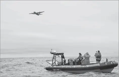  ?? JIM DAY/THE GUARDIAN ?? A Lockheed C-130 Hercules four-engine turboprop military transport aircraft joined forces with numerous vessels Wednesday in a large-scale, mass-casualty search and rescue exercise in the waters off Hillsborou­gh Bay.