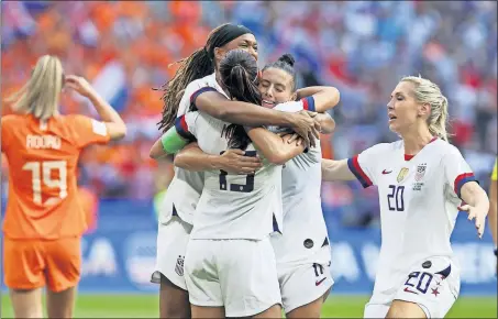  ?? [DAVID VINCENT/THE ASSOCIATED PRESS] ?? U.S. players, from left, Jessica Mcdonald, Alex Morgan, Allie Krieger and Allie Long hug after the game at the Stade de Lyon.