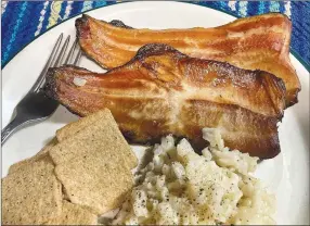  ?? Staff photograph by Flip Putthoff ?? A smoked trout dinner is a tasty finale after a day of trout fishing. The main ingredient for this smoked trout feast was caught from the White River below Beaver Dam just hours before smoking.