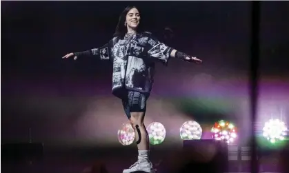  ?? Photograph: Joel C Ryan/Invision/AP ?? Billie Eilish performing on the Pyramid main stage at Glastonbur­y in June 2022 – the youngest ever performer to headline the festival.