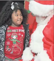  ?? FILE ?? Shyana Starr speaks with Santa Claus during a Christmas party at the Boys and Girls Club in this file photo from 2019.