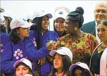  ?? Chepa Beltran Long Visual Press/Universal Images Group ?? VICE PRESIDENT Francia Elena Márquez, center right, takes a picture in August with 35 Colombian students in Bogota set to visit NASA’s space center in Houston as part of the “She’s an Astronaut” program.