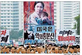  ?? JON CHOL JIN/AP 2017 ?? North Korea’s annual “anti-U.S. imperialis­m” rally attracted a reported 100,000 people last year. But Pyongyang has noticeably toned down its anti-Washington rhetoric.