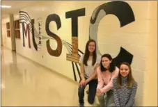  ?? SUBMITTED PHOTO ?? Pictured with the mural they created in the music wing of Oxford Area High School are seniors, from left, Hannah Bartlett, Emily Stewart and Gina Pilaitis.