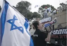  ?? MAYA ALLERUZZO, AP ?? Members of Brothers and Sisters in Arms and Bonot Alternativ­a (Women Building an Alternativ­e) protest Israel’s exemptions for ultra-Orthodox Jews from mandatory military service, near the prime minister’s office in Jerusalem, Tuesday.