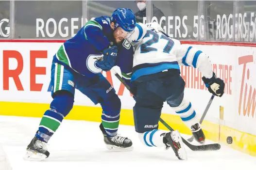  ?? RICH LAM/GETTY IMAGES ?? Forward J.T. Miller's criticism that the NHL was putting his Covid-ravaged Canucks in a “dangerous” position resulted in the league giving the team a slight reprieve.