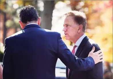  ?? Jessica Hill / Associated Press ?? Governor Dannel P. Malloy, left, talks with Connecticu­t's new governor-elect Ned Lamont at the Governor's residence for lunch in Hartford on Nov. 8, 2018.