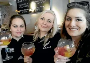  ??  ?? Annie, centre, and friends support the All Blacks.