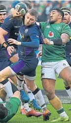  ?? SNS. ?? Finn Russell evades a challenge from Ireland’s Bundee Aki.