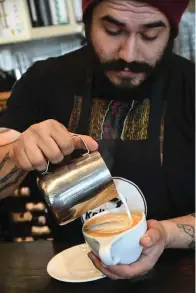  ?? The Sentinel-Record/Tanner Newton ?? ■ Bryan Ramirez pours a cup of coffee at Kollective Coffee + Tea.