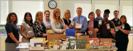  ?? SUBMITTED PHOTO ?? West Chester Rotary Club members pose for a photo of some of the supplies that will be donated to local schools.