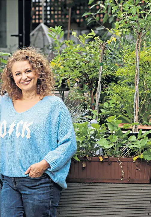  ??  ?? IT’S BEEN AN EDUCATION Nadia Sawalha and her husband, Mark Adderley, have written a book charting their experience­s of home-educating daughters Maddie and Kiki, far left